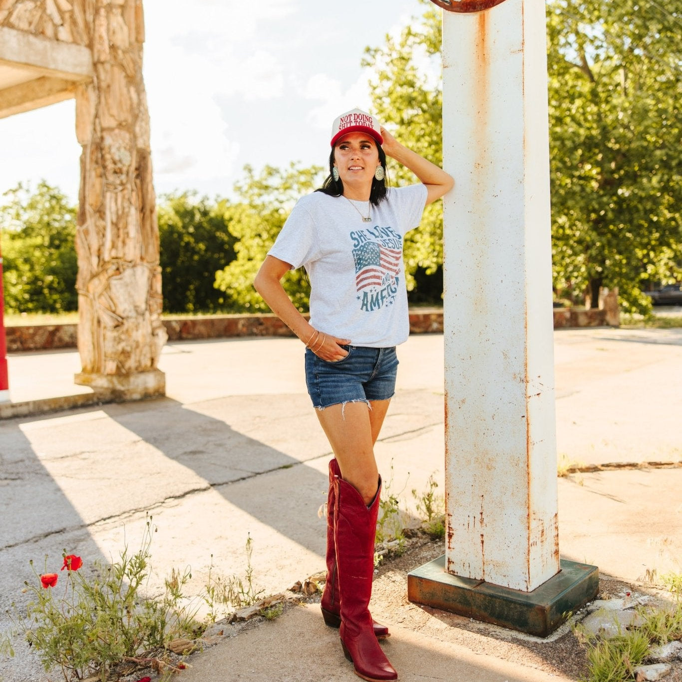 Wild Junkie She Loves Jesus & America graphic tee showing patriotic and faith-inspired design on a casual T-shirt.