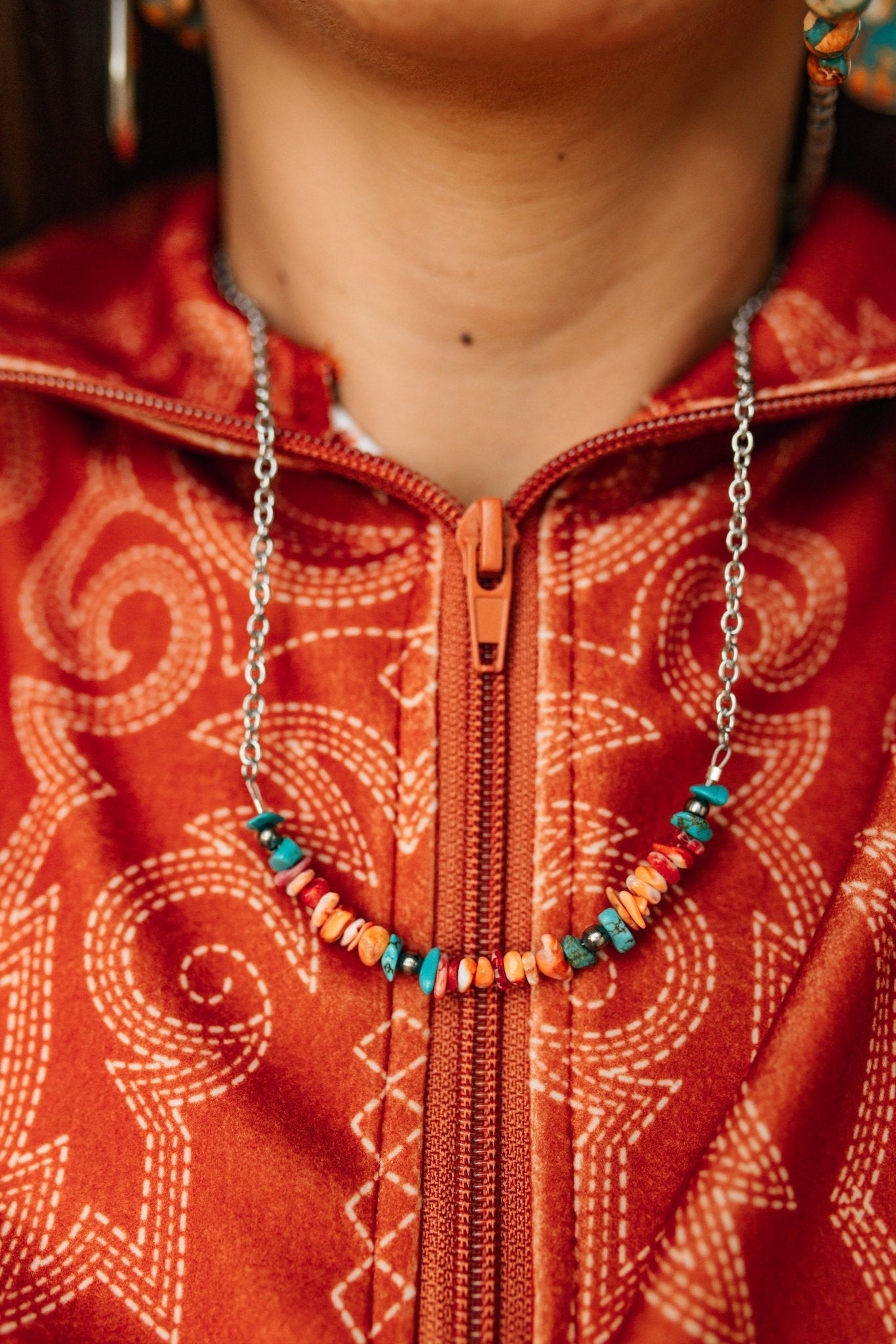 Authentic Spiny Oyster Chip Bead Necklace featuring vibrant orange and red beads, handcrafted by Wild Junkie for a boho look.