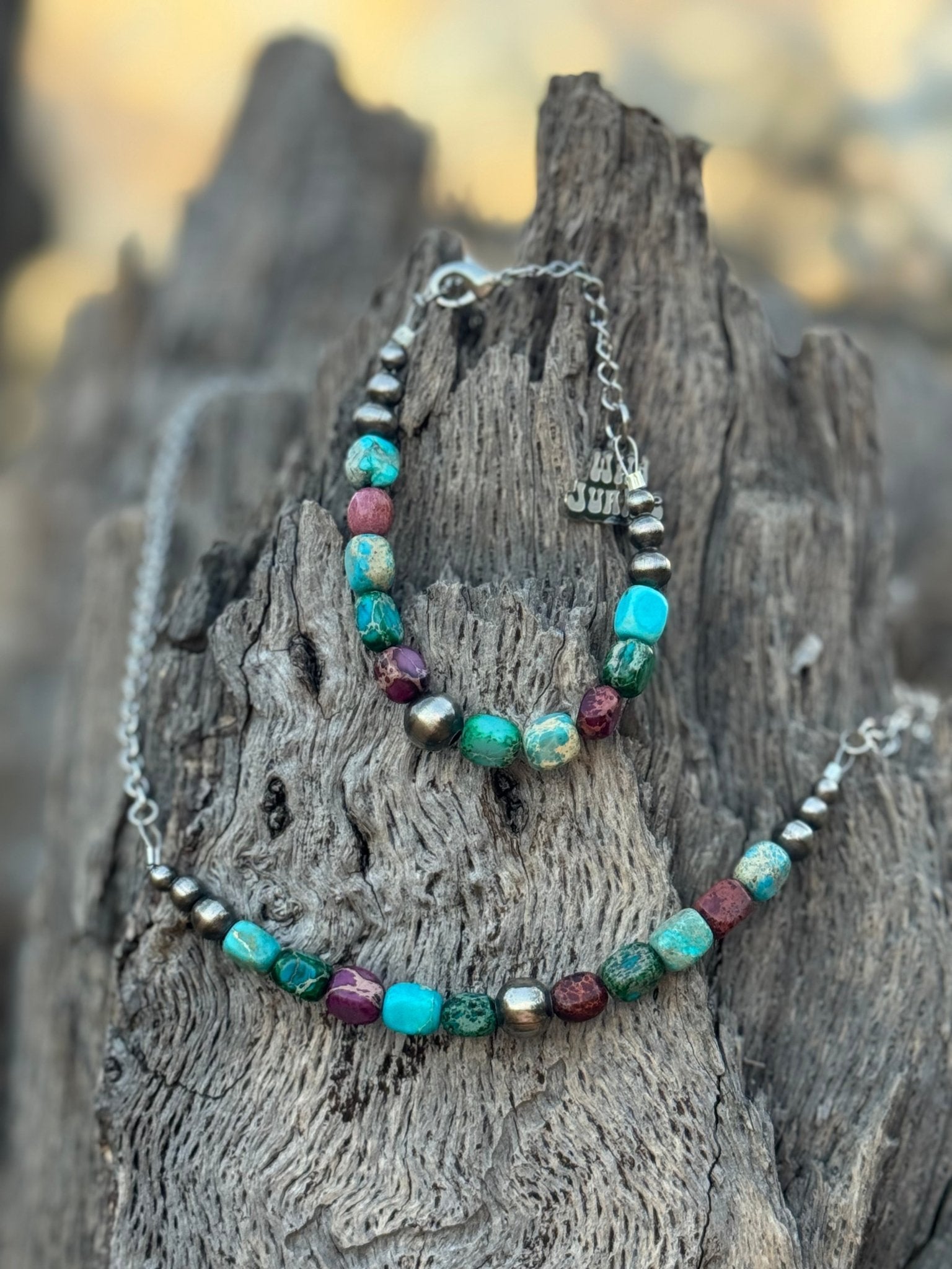 Sterling silver Jasper turquoise necklace with a detailed chain, featuring natural stone beads and intricate silver accents.