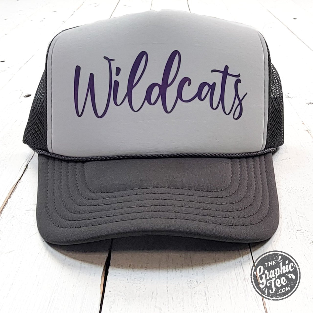 Wildcats charcoal and white foam trucker cap with adjustable snapback, branded by The Graphic Tee.