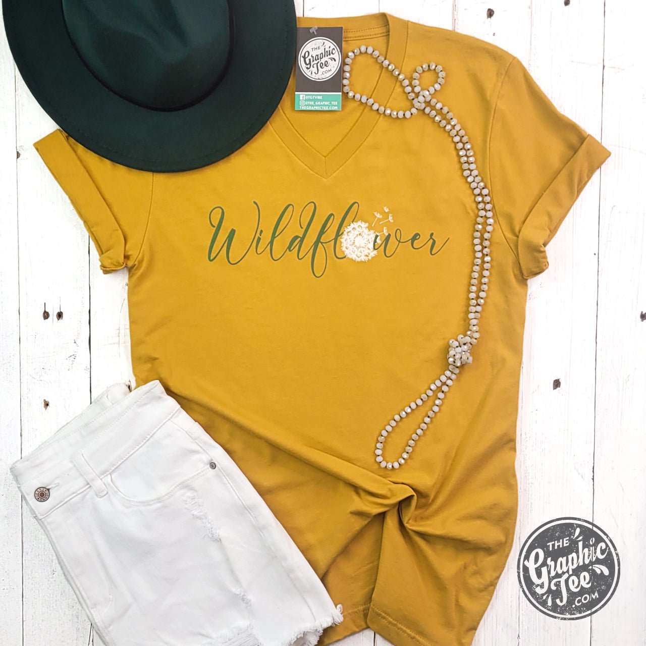 Wildflower Dandelion Mustard V-neck short sleeve graphic tee by The Graphic Tee featuring floral design on soft fabric.