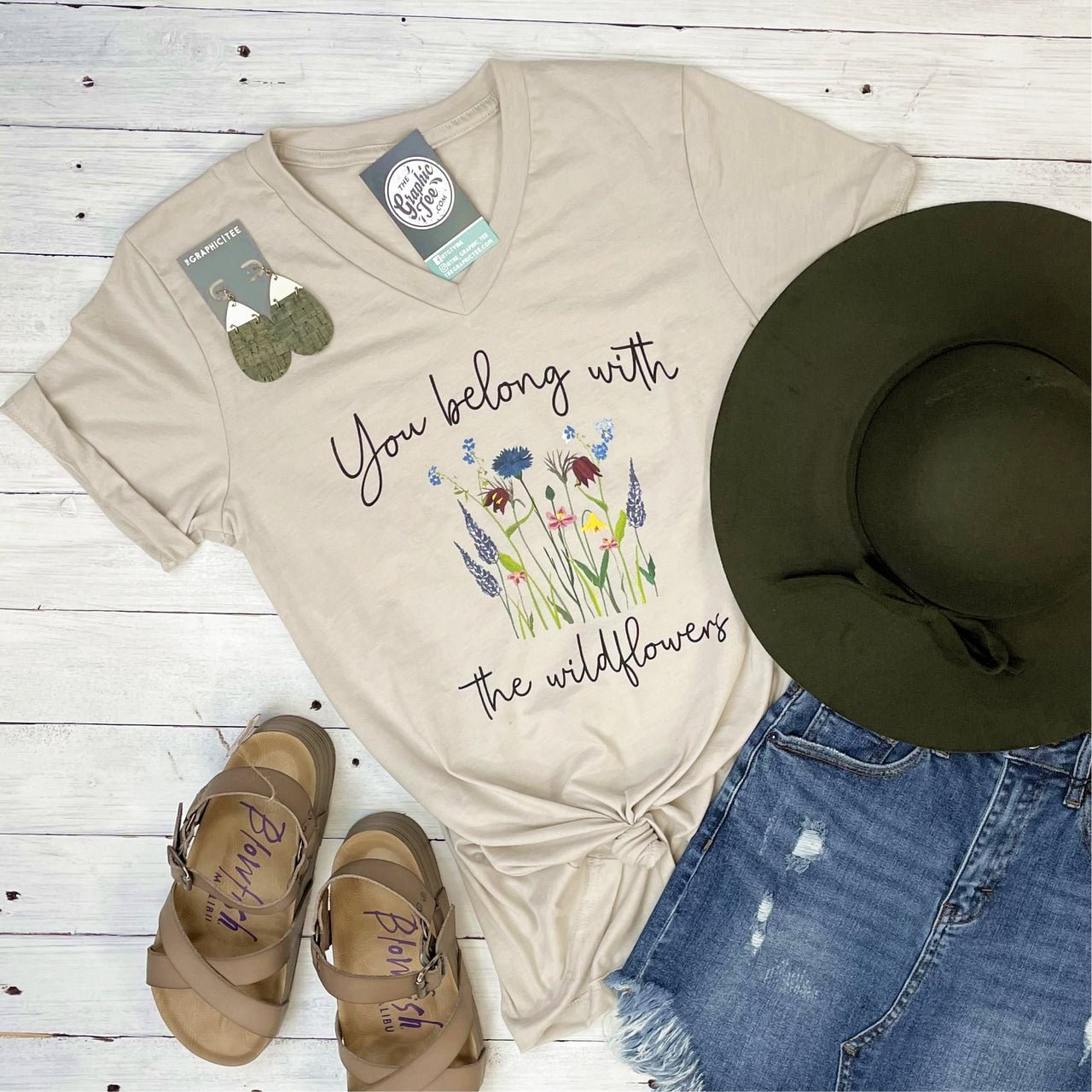You Belong with the Wildflowers V-Neck SS Graphic Tee by The Graphic Tee, featuring floral design and casual fit.
