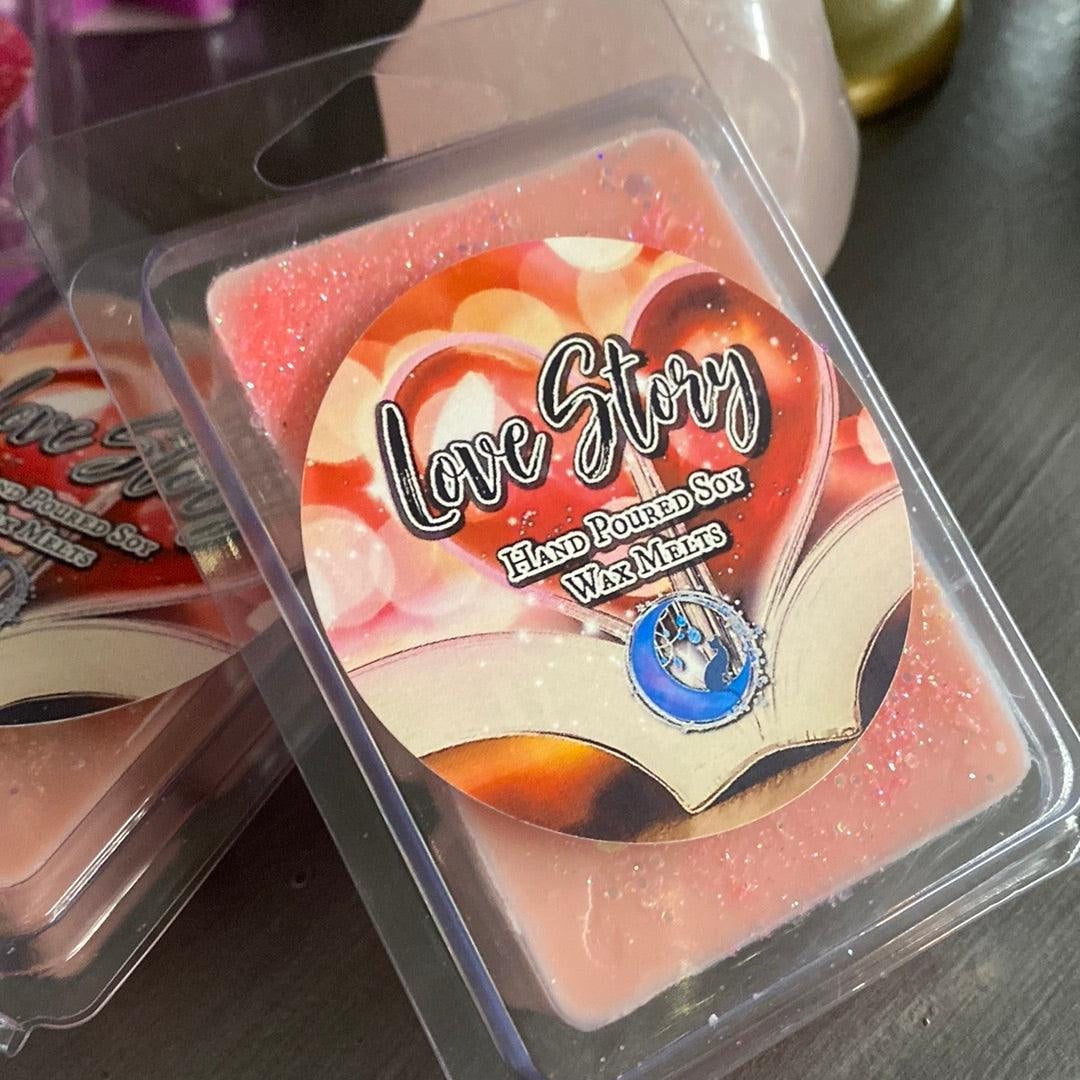 Love Story soy wax melt from Practical Magic Store, showing a decorative melt with floral design and soft pastel colors.