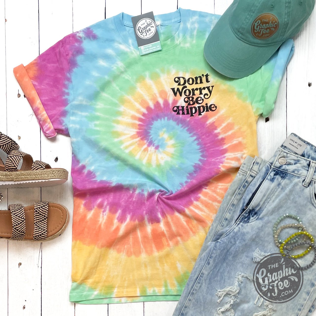 The Graphic Tee Don't Worry Be Hippie crew neck tie-dye short sleeve graphic T-shirt with colorful hippie design.