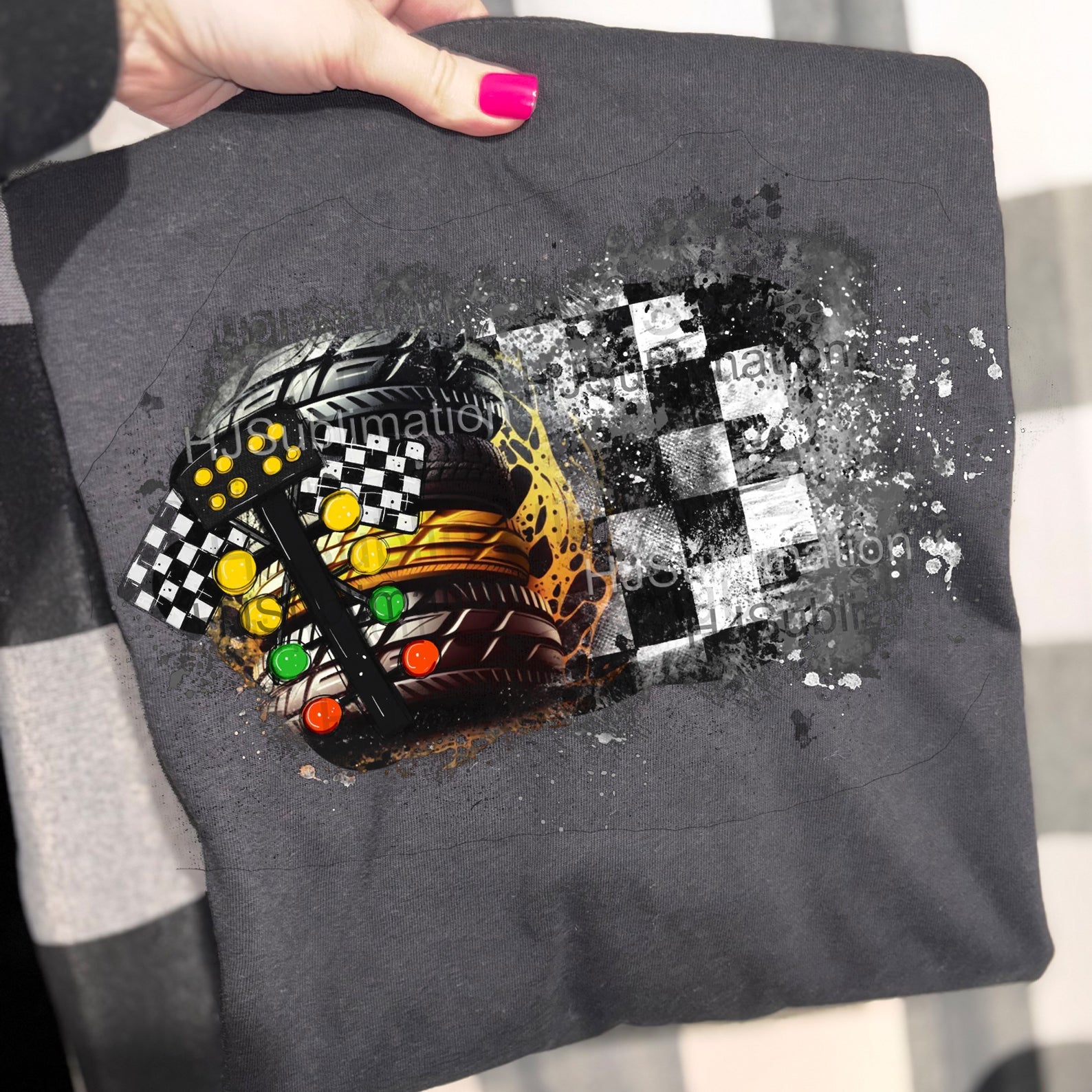 Black racing graphic tee from Anchored Grace Boutique featuring bold racing car and checkered flag design on soft cotton fabric.