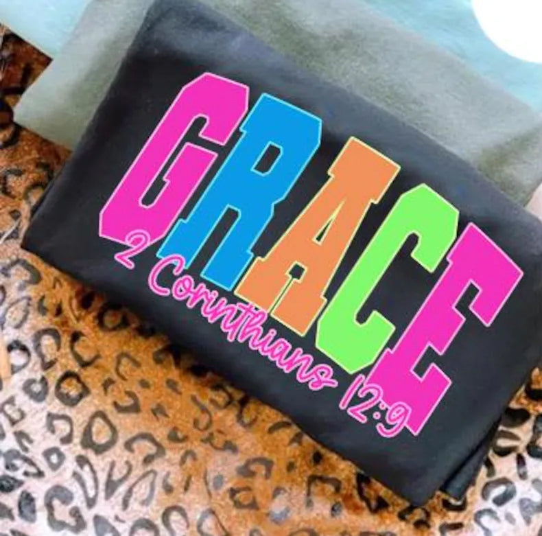 Anchored Grace Boutique neon graphic tee featuring bold, colorful design on soft cotton fabric, perfect casual wear.