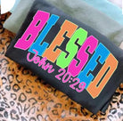 Blessed neon graphic tee from Anchored Grace Boutique featuring a vibrant, colorful design on a casual cotton t-shirt.