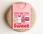 You Are Too Sweet graphic tee by Anchored Grace Boutique featuring a playful design on a casual cotton t-shirt.