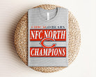 NFC North Champions Bears graphic tee by Anchored Grace Boutique featuring a bold Bears team logo and design.