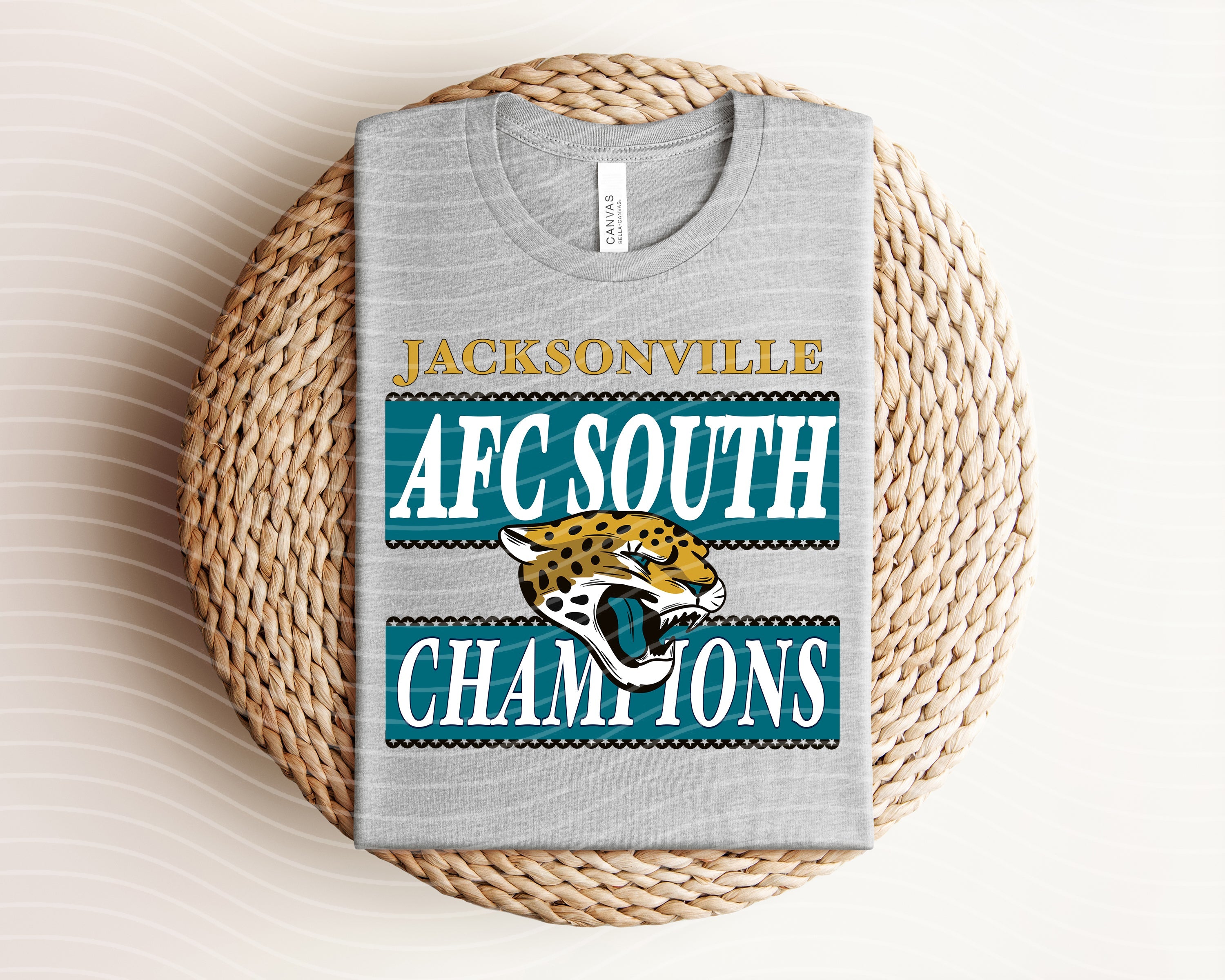 Anchored Grace Boutique AFC South Champions Jaguars graphic tee featuring team logo and vibrant design on soft cotton fabric.