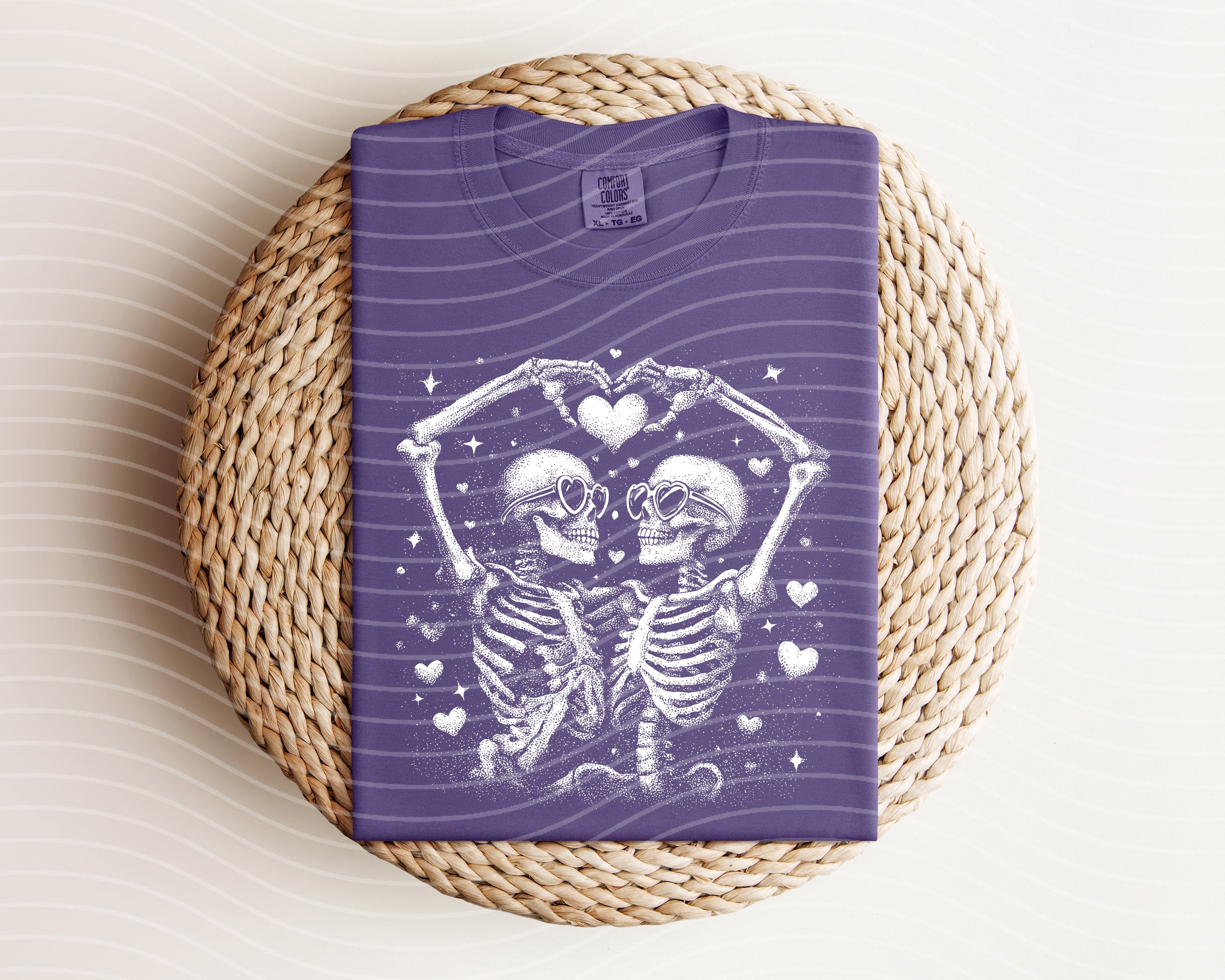 Black and white Skellies graphic tee from Anchored Grace Boutique, featuring skeletal design on a casual t-shirt.