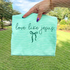 Love Like Jesus graphic tee from Anchored Grace Boutique featuring a stylish Christian-themed design on a casual t-shirt.
