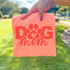 Dog Mom graphic tee in soft cotton fabric, featuring playful dog graphics and stylish lettering, by Anchored Grace Boutique.