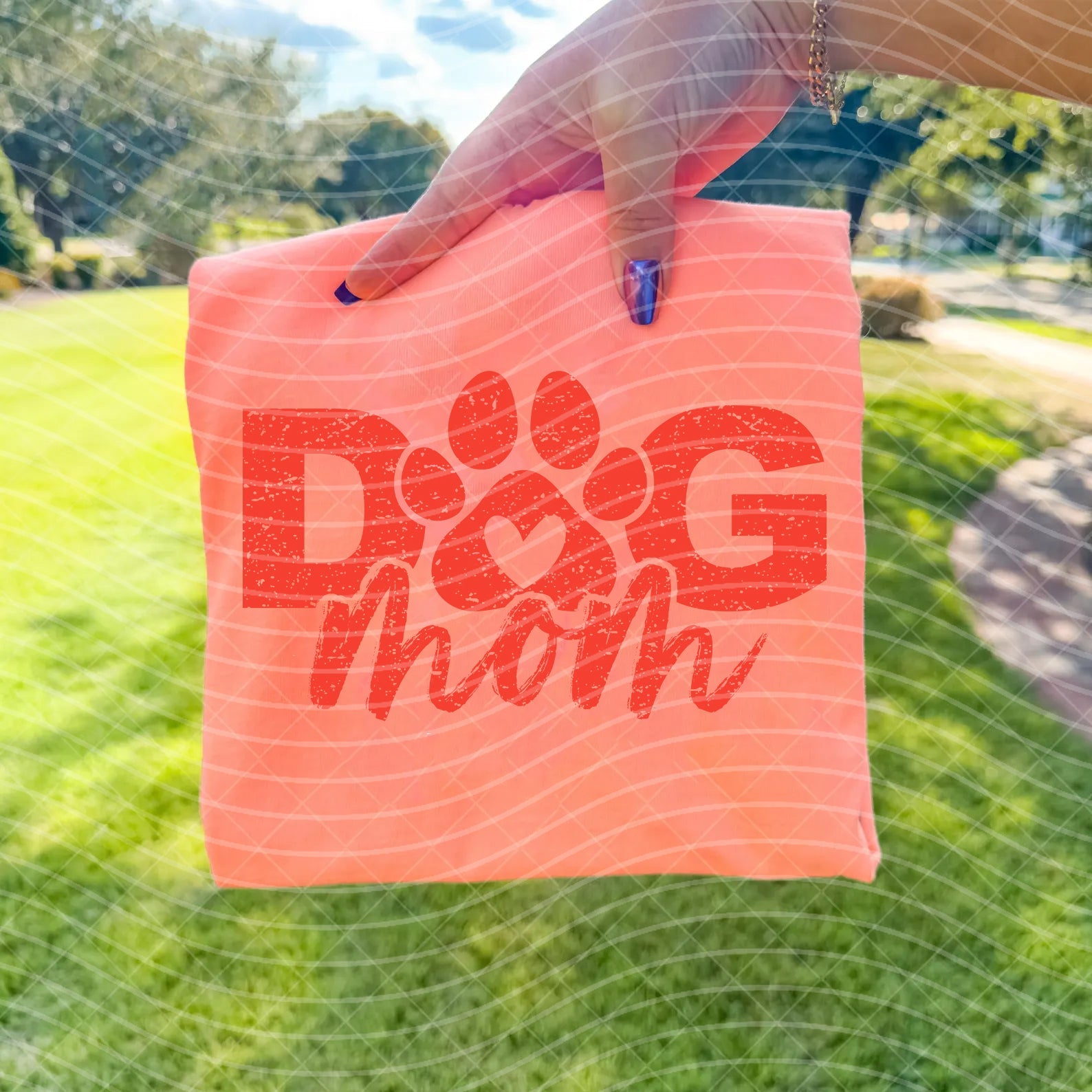 Dog Mom graphic tee in soft cotton fabric, featuring playful dog graphics and stylish lettering, by Anchored Grace Boutique.