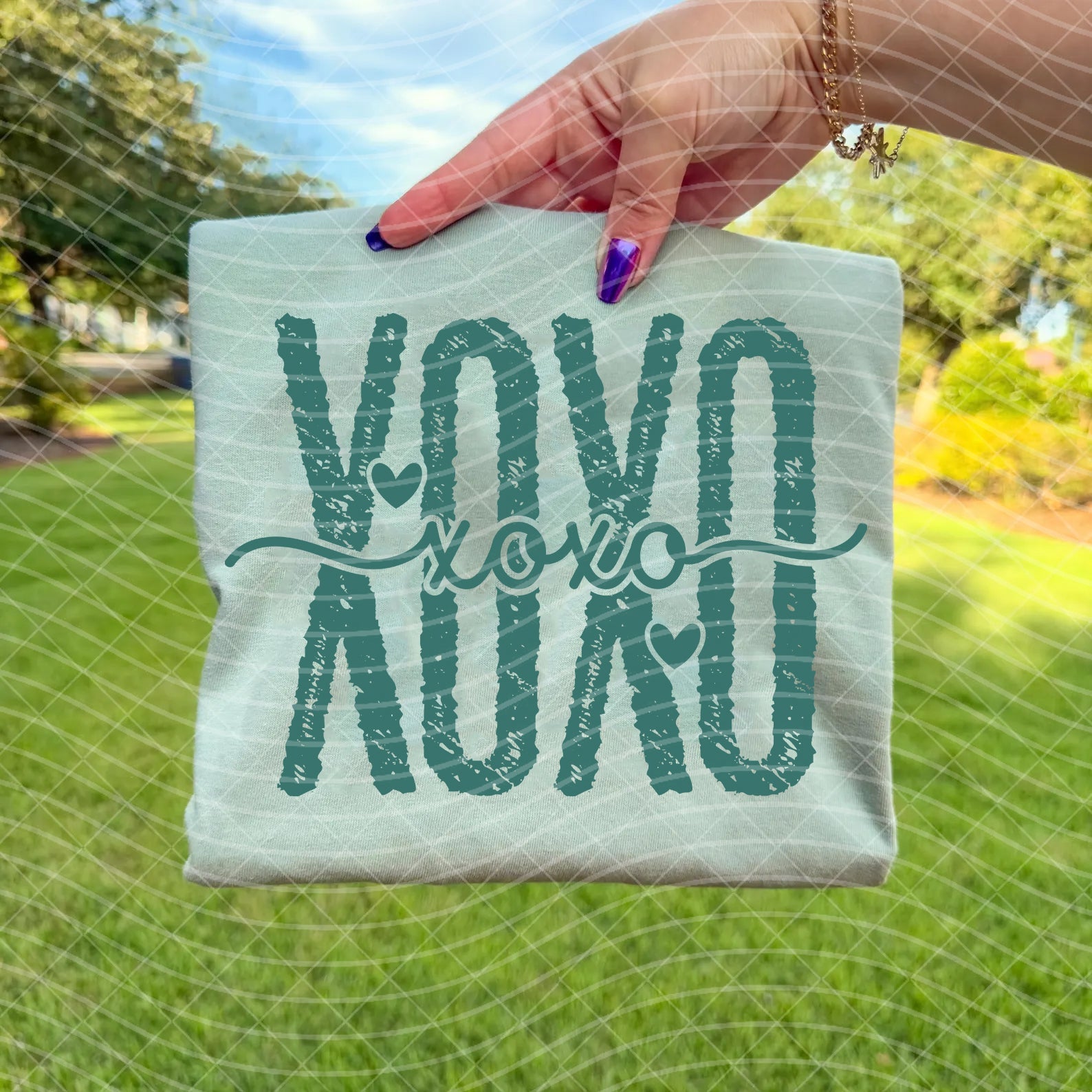 Anchored Grace Boutique XOXO graphic tee featuring bold XOXO design on soft cotton fabric, casual streetwear style.