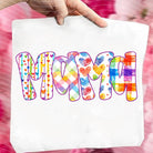 Mama Rainbow graphic tee by Anchored Grace Boutique, showing a colorful rainbow design and the text "Mama Rainbow" on soft fabric.