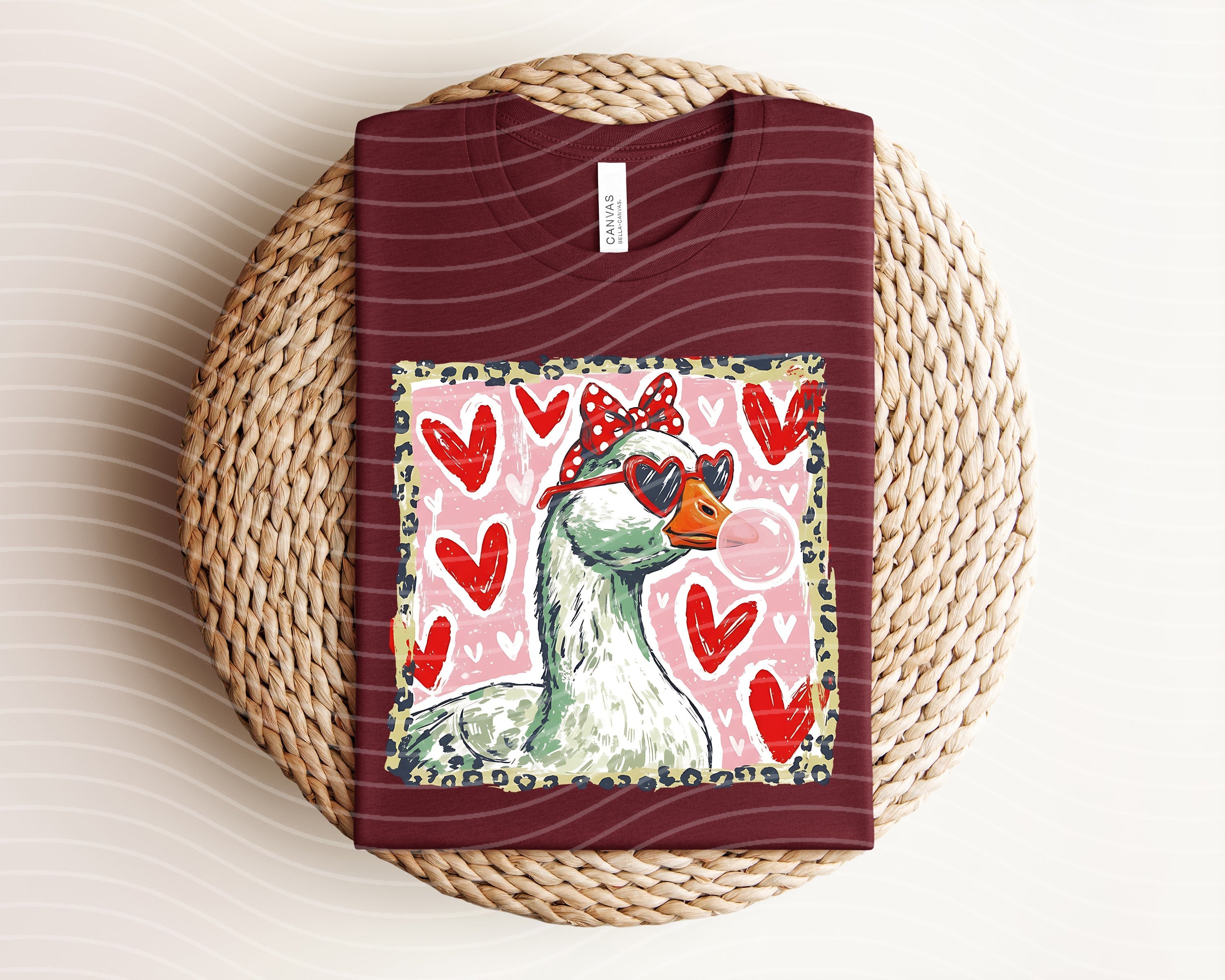 Leopard Love Goose graphic tee by Anchored Grace Boutique featuring a stylish cartoon goose with leopard print accents.