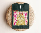Leopard Love Kitty graphic tee from Anchored Grace Boutique featuring a playful feline design on soft cotton fabric.