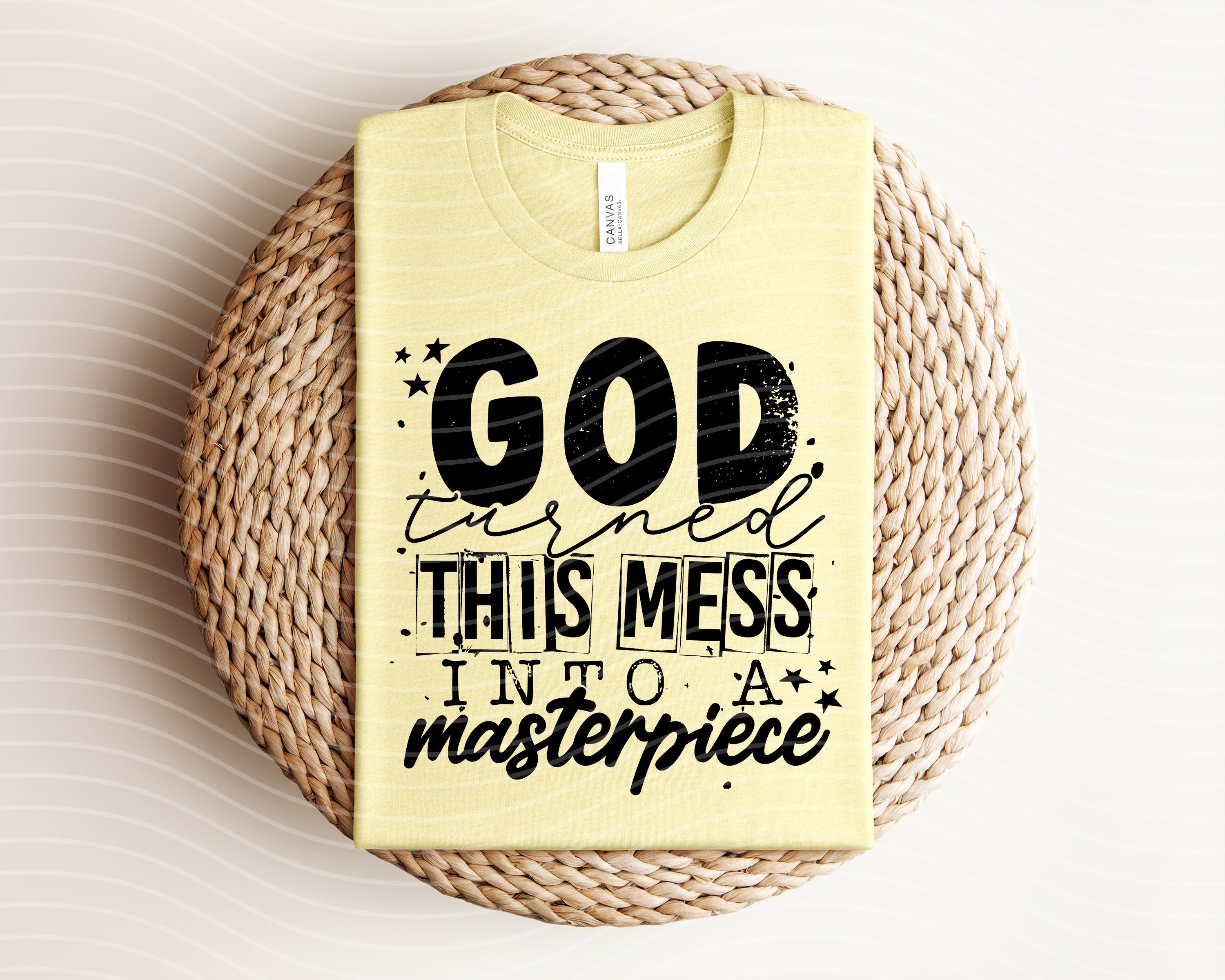 Black graphic tee featuring inspirational "God Turned This Mess Into a Masterpiece" design from Anchored Grace Boutique.