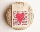 Love Kiss Amour graphic tee by Anchored Grace Boutique, featuring a stylish design on a casual cotton shirt.