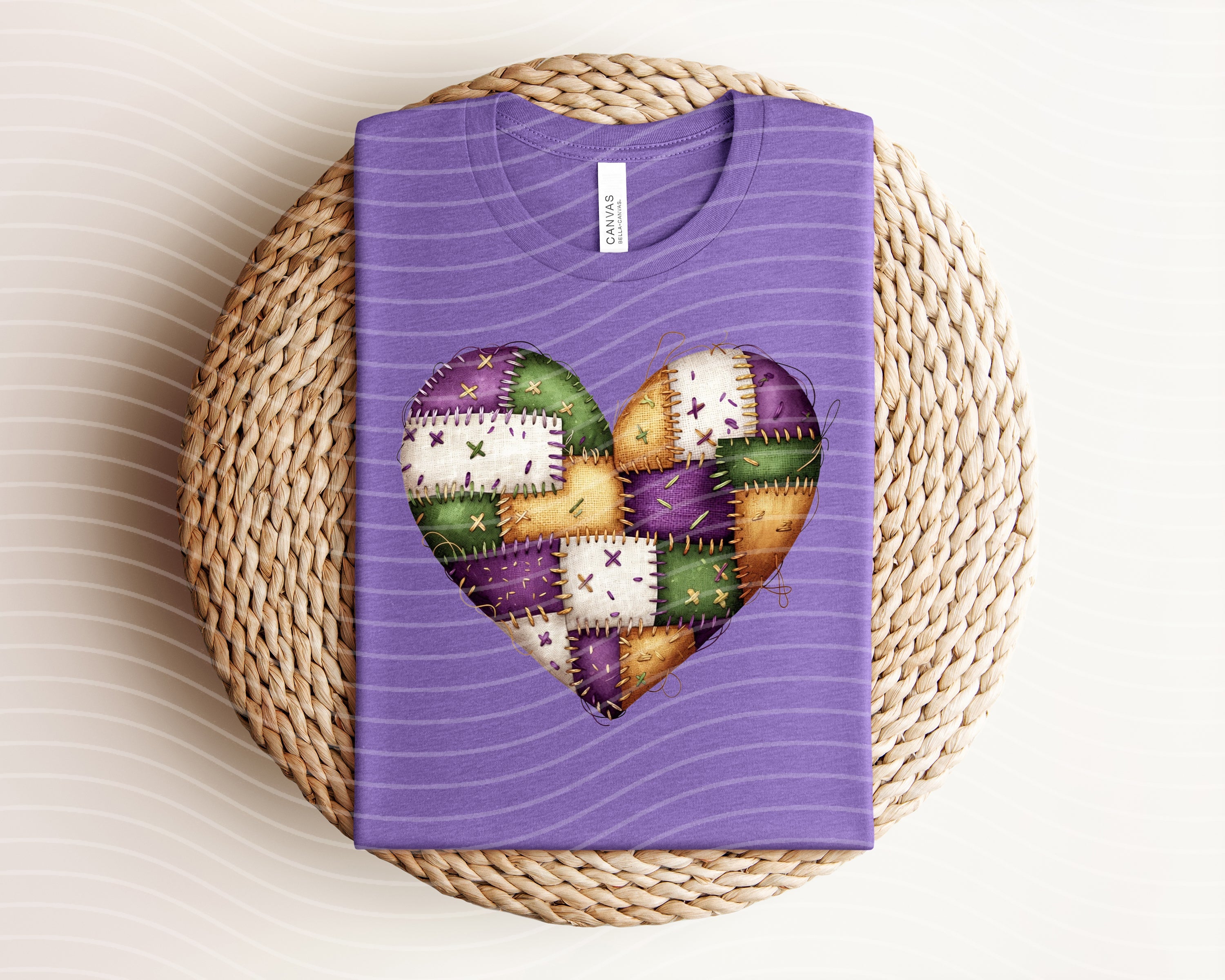 Patchwork Mardi Gras Heart graphic tee from Anchored Grace Boutique, featuring colorful patchwork and festive Mardi Gras design.