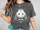 Black and white possum graphic tee from Anchored Grace Boutique, featuring a stylish wildlife illustration on a casual cotton t-shirt.