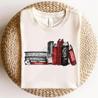 Vampire Diaries books graphic tee from Anchored Grace Boutique featuring a dark, stylish design on a casual cotton shirt.