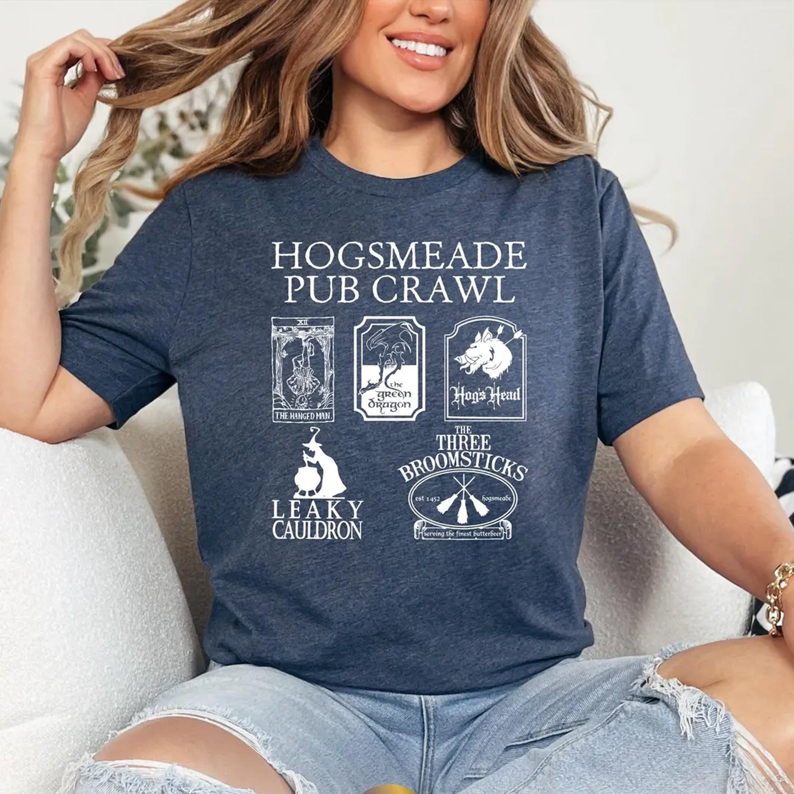 Hogsmeade Pub Crawl graphic tee by Anchored Grace Boutique featuring a detailed wizarding theme on a casual T-shirt.