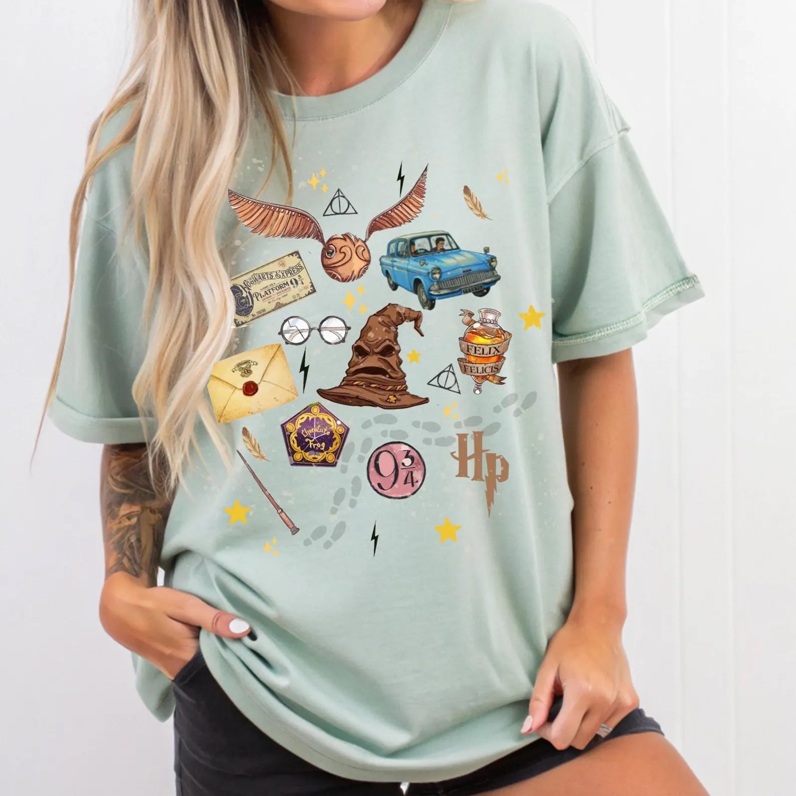 Anchored Grace Boutique HP Collage Graphic Tee featuring colorful collage design on a casual graphic t-shirt.