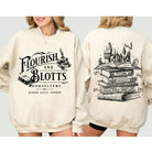 Anchored Grace Boutique Flourish and Blotts graphic tee featuring Harry Potter-themed design on a casual black t-shirt.