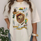 Gryffindor Collage Graphic Tee from Anchored Grace Boutique featuring a colorful Hogwarts-inspired design on a casual T-shirt.