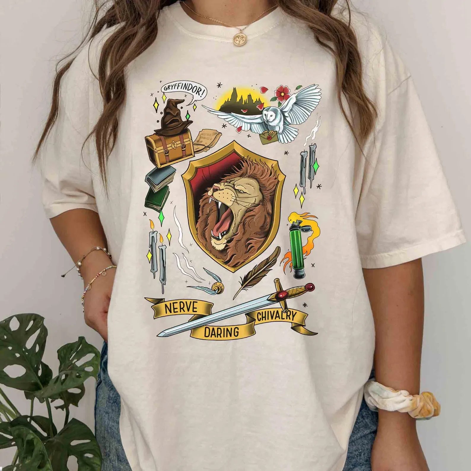 Gryffindor Collage Graphic Tee from Anchored Grace Boutique featuring a colorful Hogwarts-inspired design on a casual T-shirt.
