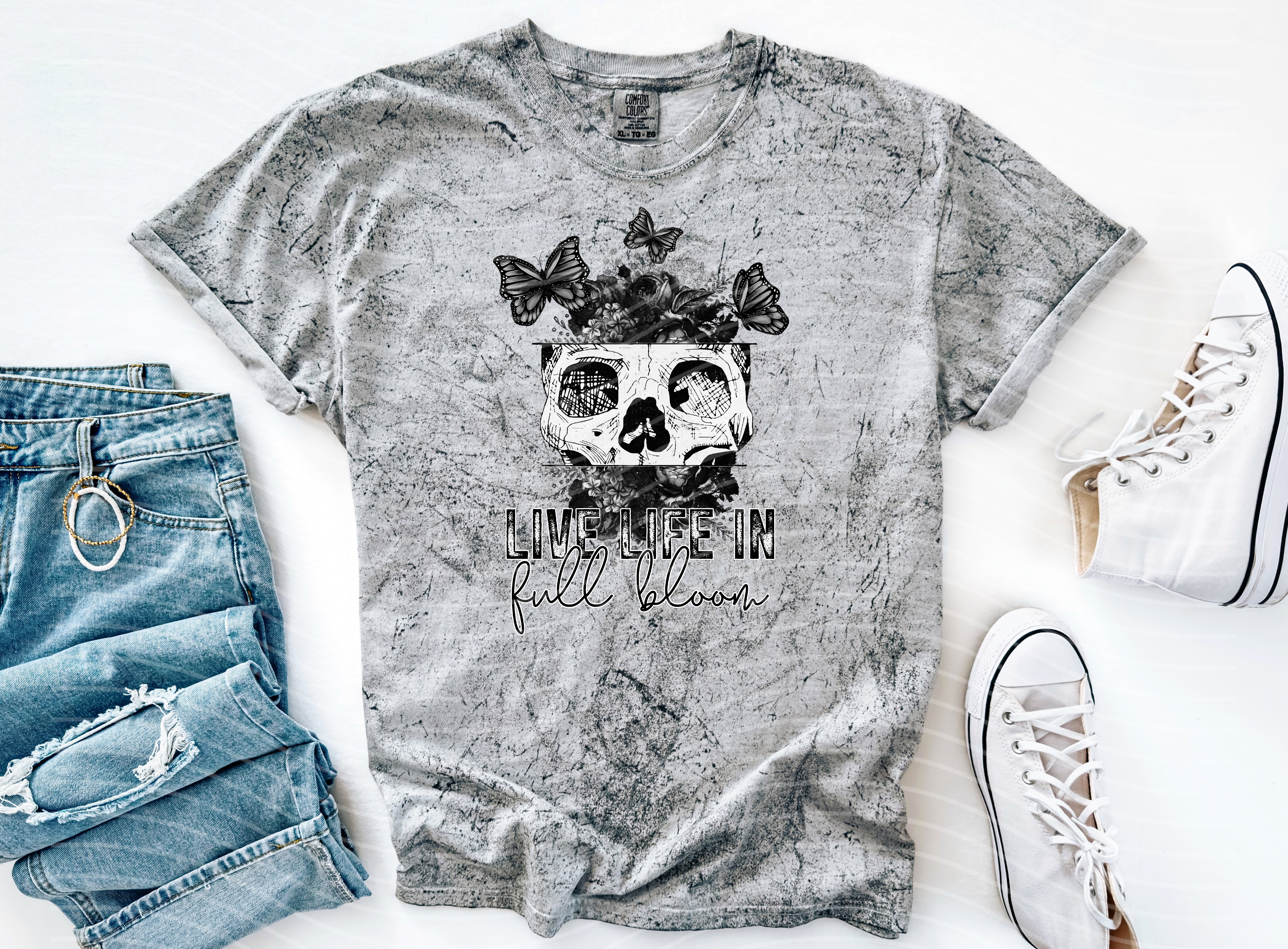 Anchored Grace Boutique graphic tee featuring a vibrant "Live Life in Full Bloom" floral design on soft fabric.
