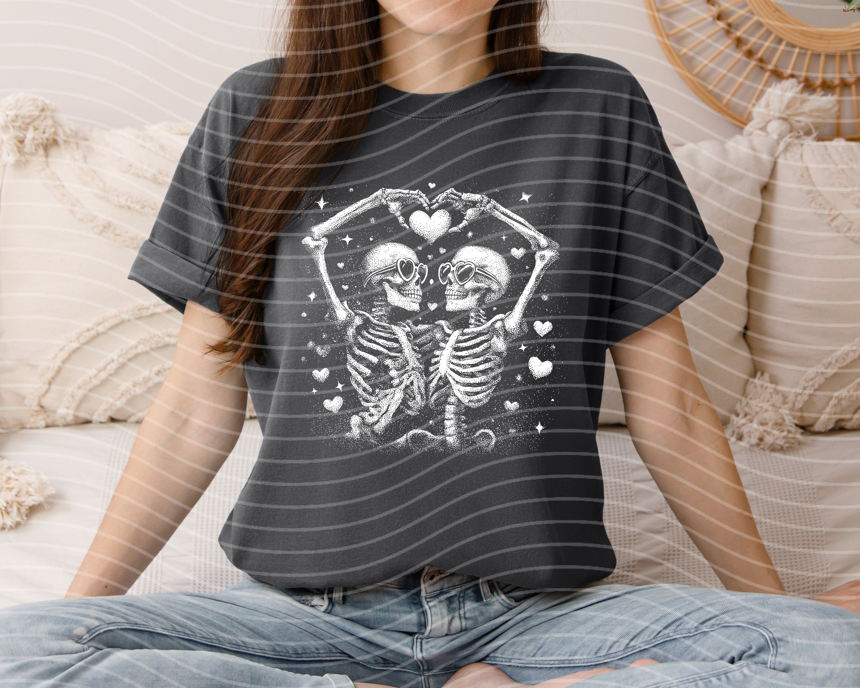 Black and white skeleton graphic tee by Anchored Grace Boutique, casual short-sleeve shirt with spooky skull design.