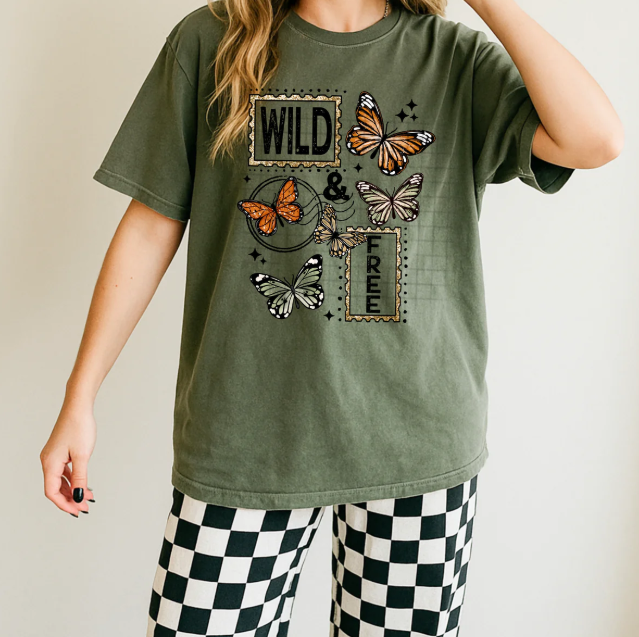 Wild & Free graphic tee by Anchored Grace Boutique featuring a stylish, casual design with bold print on soft fabric.