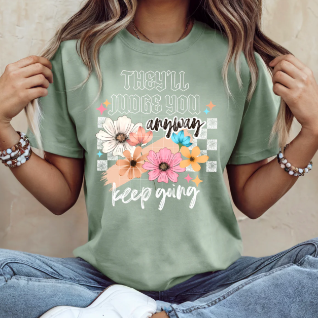 They'll Judge You Anyway graphic tee by Anchored Grace Boutique, featuring bold text design on a casual cotton t-shirt.