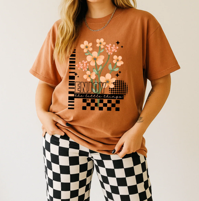 Enjoy the Little Things graphic tee from Anchored Grace Boutique featuring a casual, stylish cotton T-shirt with a positive message.