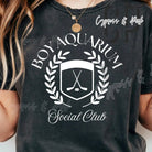 Boy wearing Anchored Grace Boutique's Aquarium Social Club graphic tee featuring colorful aquatic-themed print.