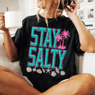 Stay Salty graphic tee from Anchored Grace Boutique featuring a stylish design on a casual t-shirt.