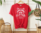 Black and white raccoon graphic tee from Anchored Grace Boutique, casual cotton t-shirt with playful animal illustration.