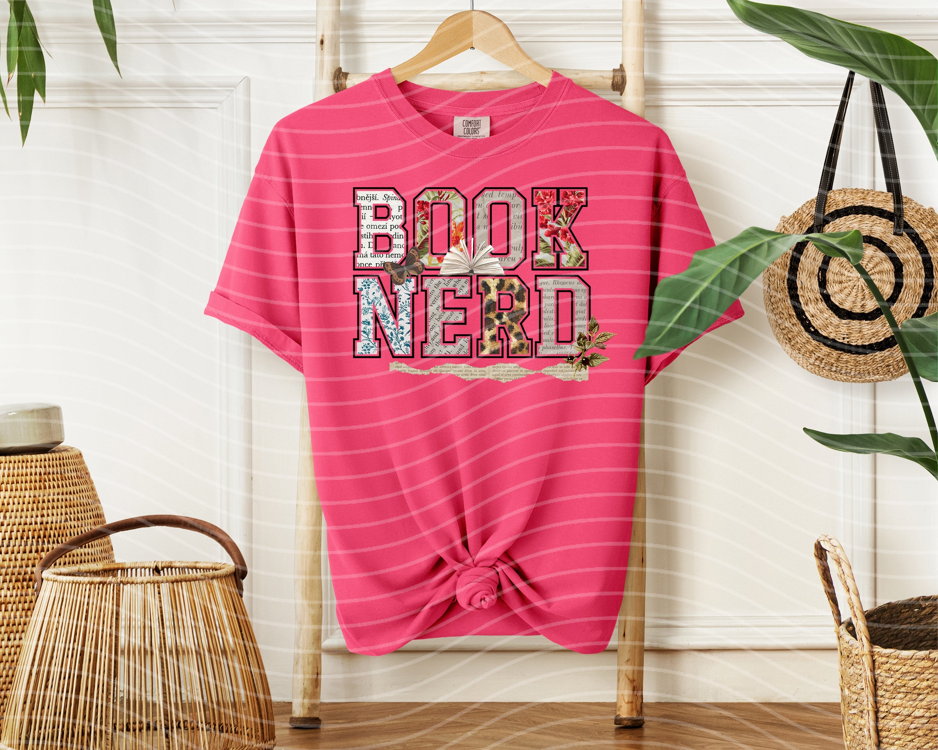 Black Book Nerd graphic tee from Anchored Grace Boutique featuring a book-themed design on soft cotton fabric.