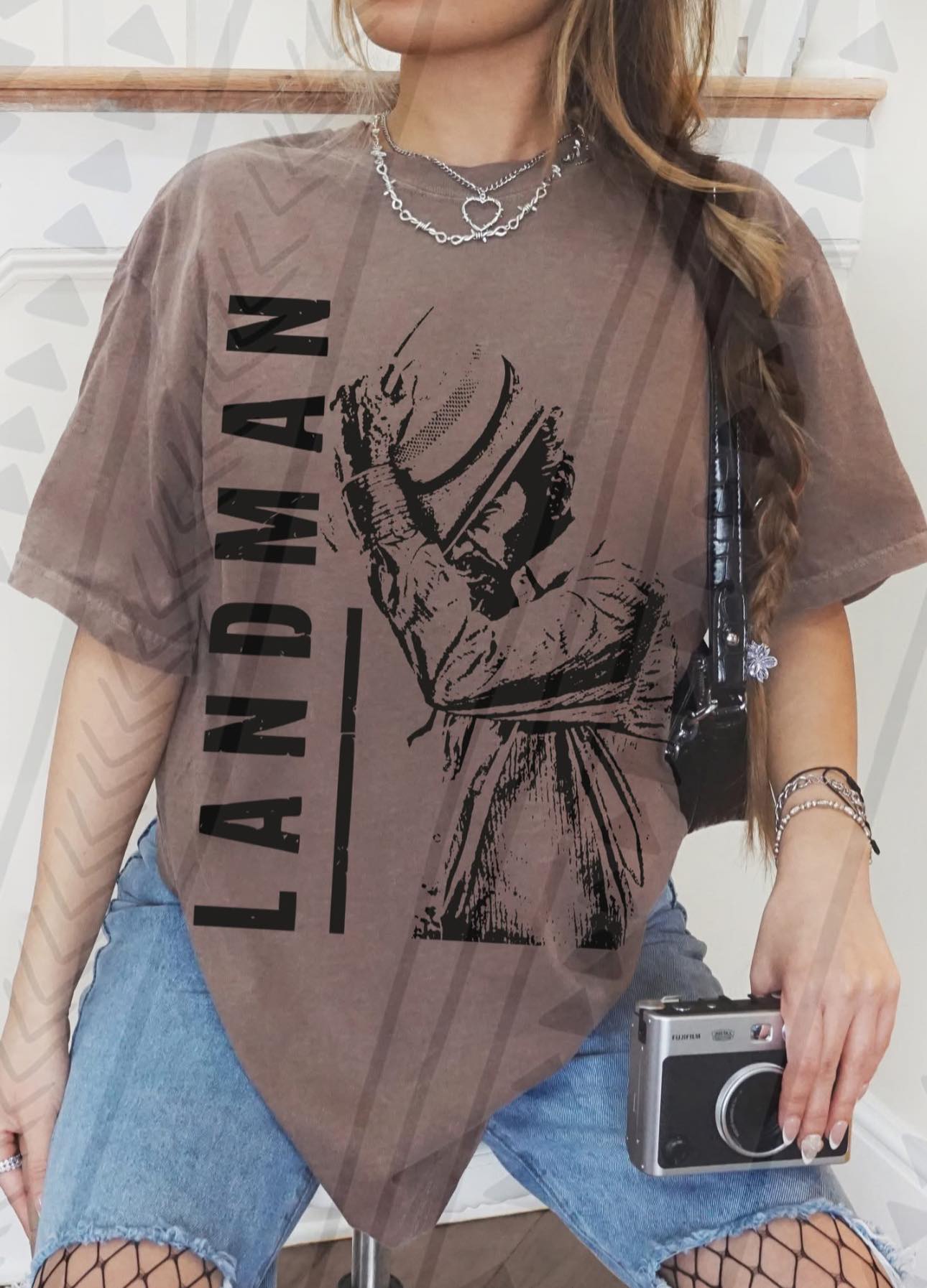 Landman graphic tee by Anchored Grace Boutique featuring bold, artistic print on soft cotton fabric, casual and stylish.