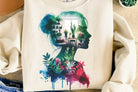 Plant Woman graphic tee by Anchored Grace Boutique, featuring a stylish illustration of a woman with plants on a casual cotton t-shirt.