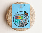 Black graphic tee from Anchored Grace Boutique featuring a "You Were Born to Fly" inspirational design on the front.