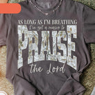 Black graphic tee from Anchored Grace Boutique featuring the phrase "I've Got a Reason to Praise the Lord" in stylish font.
