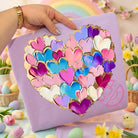 Pink Hearts graphic tee by Anchored Grace Boutique, featuring a colorful heart design on soft cotton fabric.