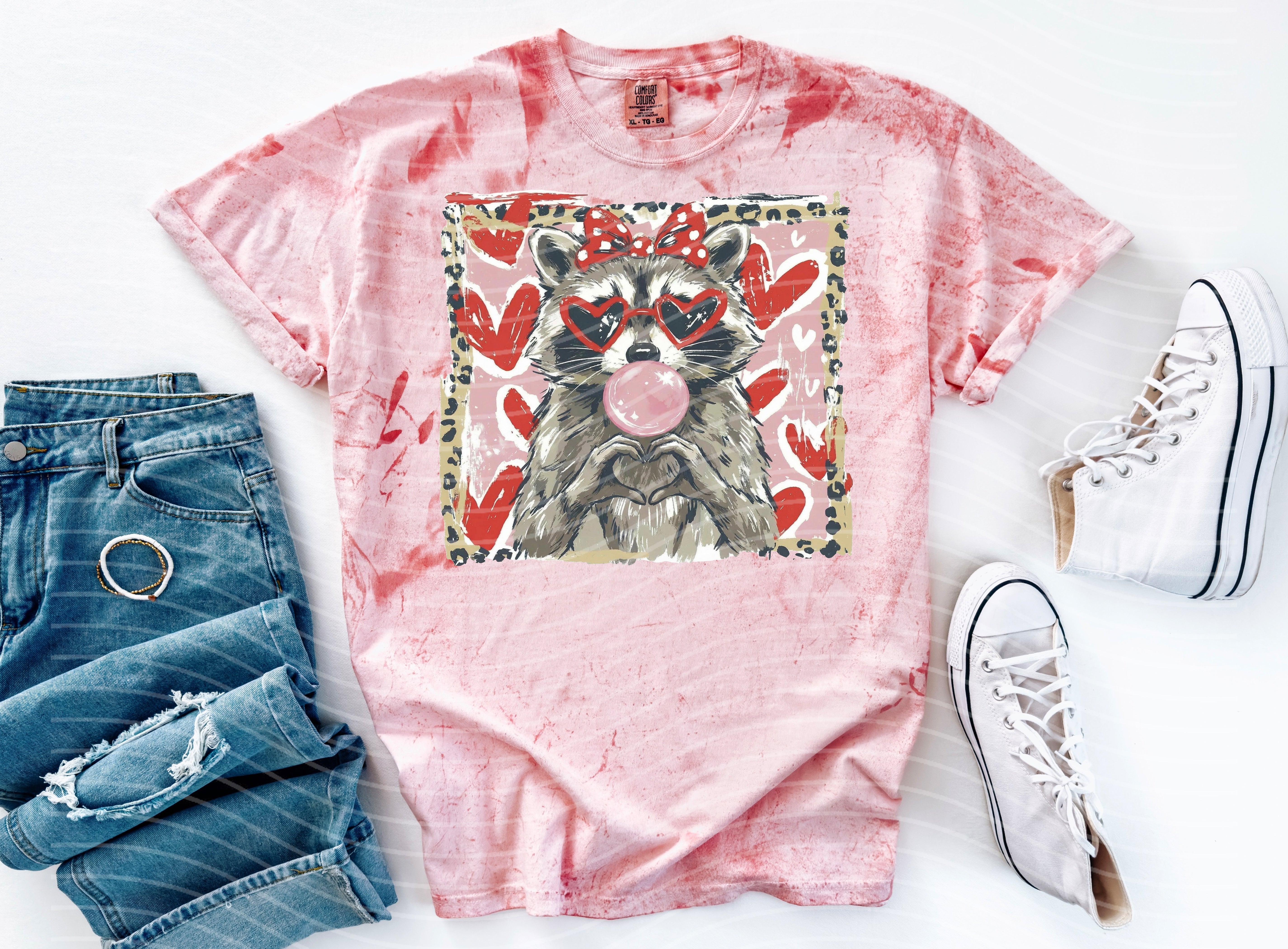 Leopard and raccoon graphic tee by Anchored Grace Boutique featuring a stylish animal print design on soft fabric.
