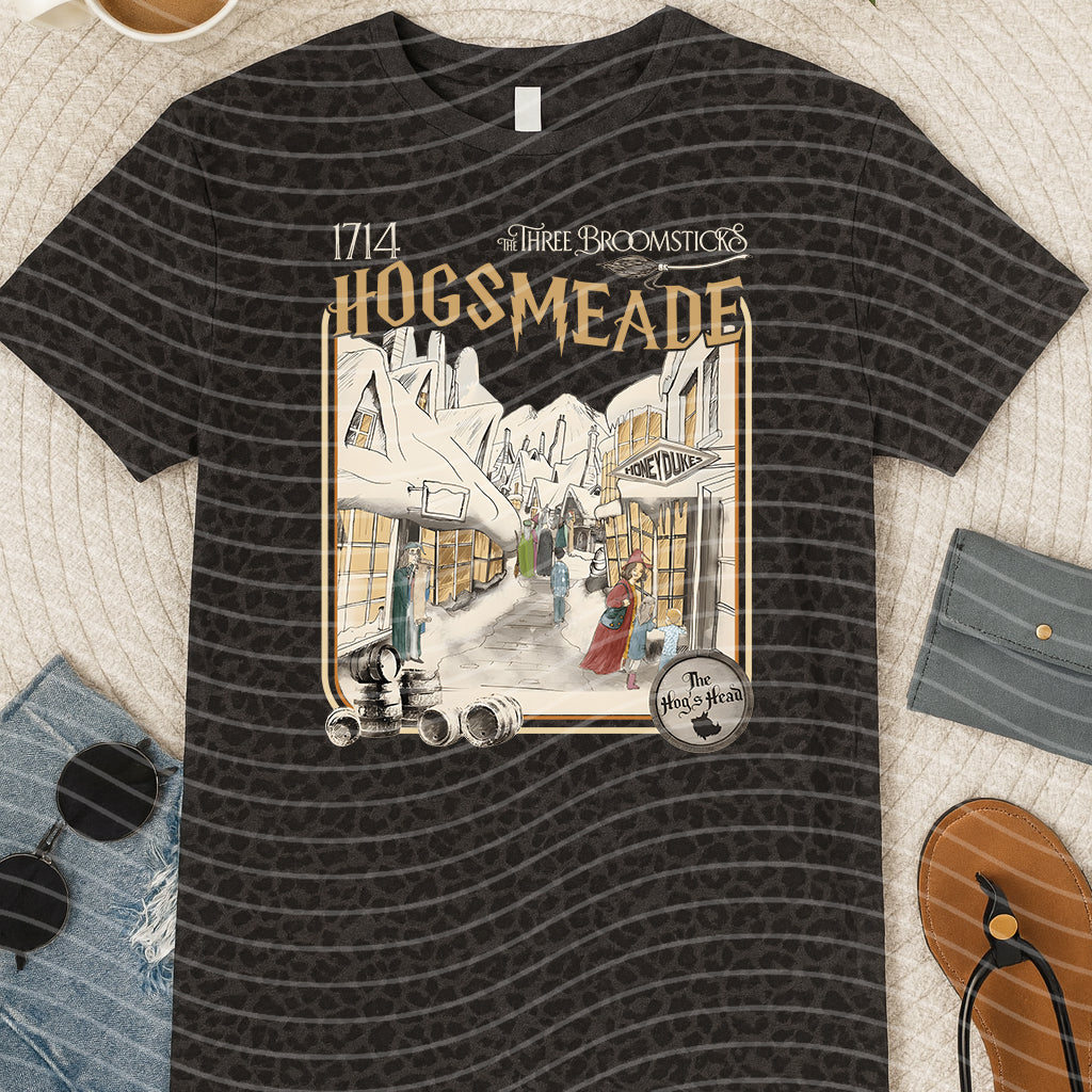 Hogsmeade graphic tee by Anchored Grace Boutique featuring a colorful Hogwarts-inspired design on a casual cotton t-shirt.