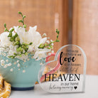 Acrylic memorial heart with "Heaven In Our Home" inscription in a gift box, from The Wind Chime Co, resting on a white surface.