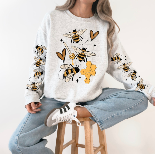 Sweet Bees graphic tee by Anchored Grace Boutique featuring a colorful bee design on soft cotton fabric.